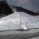 Insulated blankets cover a snow pile in order to preserve it for the following winter outside at the Rosa Khutor Alpine resort on Apr. 5, 2013.